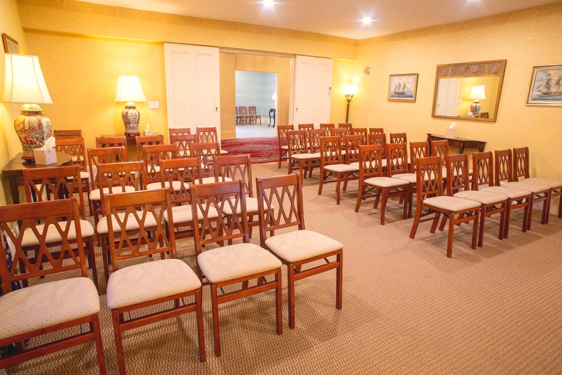 Rows of wooden folding chairs set up in Murphy Funeral Home's chapel, arranged and ready for a memorial gathering.